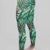 Woman in sneakers wearing NCharnt Green Ferns Leggings Woman in sneakers wearing NCharnt Green Ferns Leggings