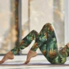 Woman wearing NCharnt Green and Gold Oak Leaf Leggings for exercise