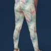 Back view of woman wearing NCharnt high-waist gym leggings in multicolour pattern