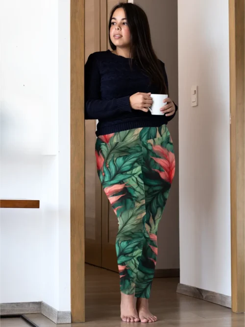 Woman wearing NCHarnt Stylish Fitness Leggings with green and peach leaves, standing with a cup of coffee Woman wearing NCHarnt Stylish Fitness Leggings with green and peach leaves, standing with a cup of coffee