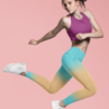 Woman jumping wearing NCharnt trendy sports leggings in blue and orange ombre