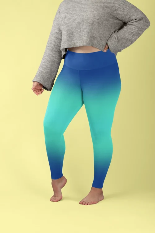 Woman wearing NCharnt printed gym tights in light and dark blue Ombre Woman wearing NCharnt printed gym tights in light and dark blue Ombre