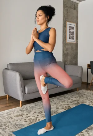 woman wearing Peach and navy blue NCharnt casual activewear leggings doing yoga
