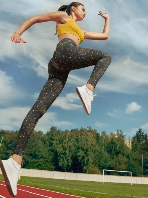 Woman running wearing NCharnt trendy gym leggings with Celestial Geometric print on black Woman running wearing NCharnt trendy gym leggings with Celestial Geometric print on black